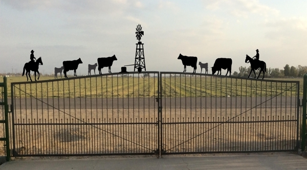 metal gate toppers cows calks riders horses